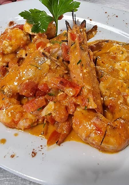 Plate with prawns from the menu of Kymata Restaurant